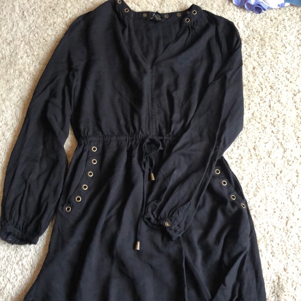 Black mini dress with gold details and pockets